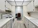 Efficient kitchen with white appliances leading into versatile space, ideal for home office at 11251 80Th Ave # 305, Seminole, FL 33772