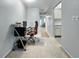 Office area with hallway view, desk, and chair at 11251 80Th Ave # 305, Seminole, FL 33772