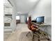 Office view extending to the living room with kitchen in background at 11251 80Th Ave # 305, Seminole, FL 33772