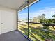 View from the screened lanai showcasing the lush green landscape and blue sky at 11251 80Th Ave # 305, Seminole, FL 33772