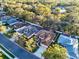 An aerial view of a single-Gathering home featuring a well-manicured lawn and a long driveway at 11835 Hollyhock Dr, Lakewood Ranch, FL 34202