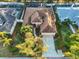 Overhead view of a single-Gathering home with a well-maintained yard in a residential neighborhood at 11835 Hollyhock Dr, Lakewood Ranch, FL 34202