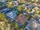 Aerial perspective of a home in a neighborhood setting with mature trees and well-kept yards at 11835 Hollyhock Dr, Lakewood Ranch, FL 34202