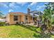 Spacious backyard with a screened-in pool, patio, and lush green lawn at 11835 Hollyhock Dr, Lakewood Ranch, FL 34202