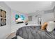 Bedroom with a wall-mounted television and an archway leading to an adjacent room or area at 11835 Hollyhock Dr, Lakewood Ranch, FL 34202