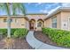 Inviting home entrance featuring a landscaped walkway and attractive front door at 11835 Hollyhock Dr, Lakewood Ranch, FL 34202