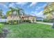 Lovely home with manicured lawn, mature landscaping, and an attached two-car garage at 11835 Hollyhock Dr, Lakewood Ranch, FL 34202