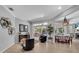 Spacious living area with view of patio and pool; features stylish furnishings and decor at 11835 Hollyhock Dr, Lakewood Ranch, FL 34202