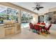 Covered outdoor dining area with a grill and view of the pool at 11835 Hollyhock Dr, Lakewood Ranch, FL 34202