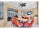 Covered patio with dining set and outdoor kitchen, perfect for entertaining at 11835 Hollyhock Dr, Lakewood Ranch, FL 34202