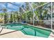 Sparkling pool surrounded by lush landscaping in a screened-in enclosure at 11835 Hollyhock Dr, Lakewood Ranch, FL 34202