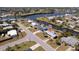 Beautiful overhead view shows neighborhood street and houses situated along canals with waterfront access at 125 Palmetto Ne Cir, Port Charlotte, FL 33952
