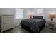 Cozy bedroom featuring neutral-toned decor, comfortable bedding, and ample natural light at 125 Palmetto Ne Cir, Port Charlotte, FL 33952