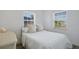 Charming bedroom filled with natural light and featuring neutral decor and comfortable bedding at 125 Palmetto Ne Cir, Port Charlotte, FL 33952