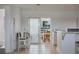 Bright dining area with sliding glass doors offering serene backyard views at 125 Palmetto Ne Cir, Port Charlotte, FL 33952