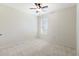 Bedroom featuring a ceiling fan, neutral carpet and a bright window at 12533 Night View Dr, Sarasota, FL 34238