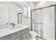 This bathroom boasts modern fixtures, a glass shower, and sleek gray vanity at 17907 Palmiste Dr, Bradenton, FL 34202