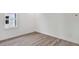 This bedroom offers wood floors and a bright window, creating a welcoming space at 17907 Palmiste Dr, Bradenton, FL 34202