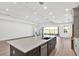 Kitchen island with stainless steel dishwasher and faucet, and view of the backyard at 17907 Palmiste Dr, Bradenton, FL 34202