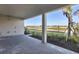 A covered outdoor patio offers a great view of the lake and landscape at 17907 Palmiste Dr, Bradenton, FL 34202