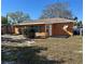 Spacious backyard featuring lush green grass, trees, and a small shed at 1804 Bayshore Gardens Pkwy, Bradenton, FL 34207