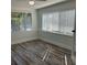 This bedroom is naturally illuminated by the large windows and features modern wood-look flooring at 1804 Bayshore Gardens Pkwy, Bradenton, FL 34207