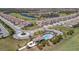 Aerial view of the community showcasing lush landscaping, a pool, and golf course, offering a vibrant lifestyle at 18113 Gawthrop Dr # 103, Bradenton, FL 34211
