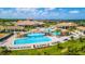 Aerial view of a resort-style community with a large pool and clubhouse at 18113 Gawthrop Dr # 103, Bradenton, FL 34211