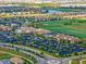 Aerial view of a community with a golf course, lakes, and extensive parking at 18113 Gawthrop Dr # 103, Bradenton, FL 34211