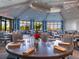 Well-appointed dining area with large windows and stylish table settings at 18113 Gawthrop Dr # 103, Bradenton, FL 34211
