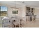 Bright dining room features a light-colored table with seating for six and a built-in bar at 18113 Gawthrop Dr # 103, Bradenton, FL 34211