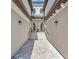 Long entryway featuring brick pathway and steps leading to double front doors at 18113 Gawthrop Dr # 103, Bradenton, FL 34211
