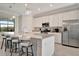 A kitchen features granite counters, stainless steel appliances and a center island with barstool seating at 18113 Gawthrop Dr # 103, Bradenton, FL 34211