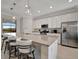 A kitchen features granite counters, stainless steel appliances and a center island with barstool seating at 18113 Gawthrop Dr # 103, Bradenton, FL 34211