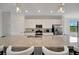 A kitchen features granite counters, stainless steel appliances and a center island with barstool seating at 18113 Gawthrop Dr # 103, Bradenton, FL 34211