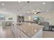 Spacious kitchen with a large island, granite countertops, and open floor plan at 18113 Gawthrop Dr # 103, Bradenton, FL 34211