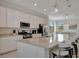 Open kitchen view showcases granite counters, stainless steel appliances, and a layout perfect for entertaining at 18113 Gawthrop Dr # 103, Bradenton, FL 34211