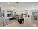 Open concept living space features a large living room, dining area, and stainless steel kitchen at 18113 Gawthrop Dr # 103, Bradenton, FL 34211