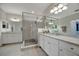 Beautiful main bathroom featuring dual sinks, walk-in shower and granite countertops at 18113 Gawthrop Dr # 103, Bradenton, FL 34211
