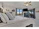 Bedroom with king bed, soft pillows, access to the patio and large window at 18113 Gawthrop Dr # 103, Bradenton, FL 34211