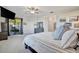 Spacious main bedroom with sitting area, patio access and modern furnishings at 18113 Gawthrop Dr # 103, Bradenton, FL 34211