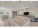 Open concept living space features a large kitchen island, dining area, and living room at 18113 Gawthrop Dr # 103, Bradenton, FL 34211