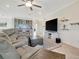Open concept living space features a living room and bar at 18113 Gawthrop Dr # 103, Bradenton, FL 34211