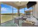 Relaxing screened patio with comfortable seating and golf course views at 18113 Gawthrop Dr # 103, Bradenton, FL 34211