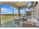 Enjoy this screened patio featuring an outdoor living area with comfortable seating and serene golf course views at 18113 Gawthrop Dr # 103, Bradenton, FL 34211