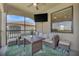 Inviting outdoor patio with seating, a ceiling fan, and tranquil golf course views at 18113 Gawthrop Dr # 103, Bradenton, FL 34211