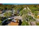 Neighborhood aerial view showcasing mature trees, well-maintained streets, and water views in the distance at 2021 Central Ave, Sarasota, FL 34234