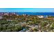 Sweeping aerial shot of a residential area with city and ocean views in the background at 2021 Central Ave, Sarasota, FL 34234