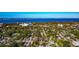 Stunning aerial view showcasing the home's location near the bay with lush trees, and city views at 2021 Central Ave, Sarasota, FL 34234