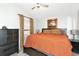 Comfortable bedroom with a large bed, dresser, and window with natural light at 2021 Central Ave, Sarasota, FL 34234